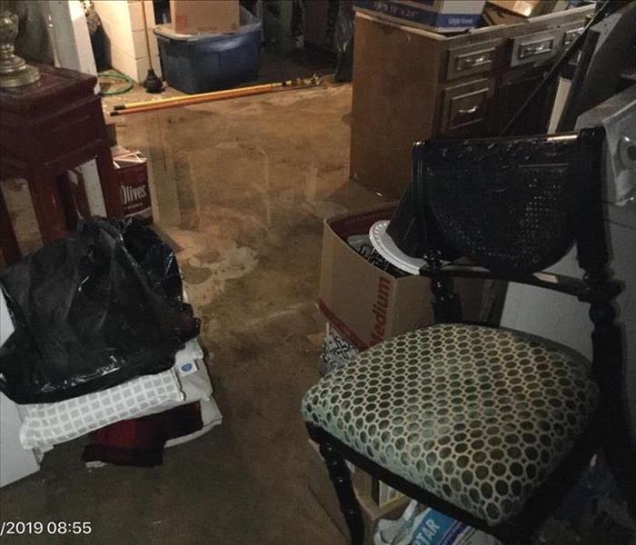 Standing water in basement with contents